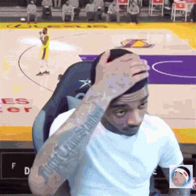 Man Sitting On Basketball Court With Hand On Head GIF
