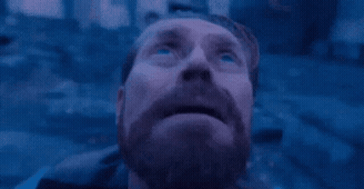 Man Sitting On Beach With MG Letters GIF