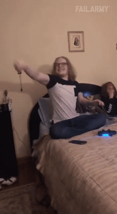 Man Sitting On Bed Arms Outstretched Failarmy GIF