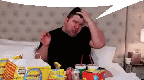 Man Sitting On Bed With Chips Bag Sticker