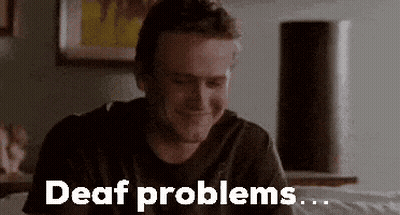 Man Sitting On Bed With Deaf Problems GIF