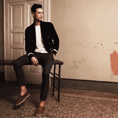 Man Sitting On Bench In Front Of Door GIF