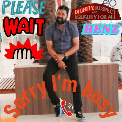 Man Sitting on Bench Saying Please Wait