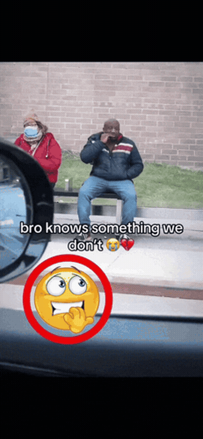 Man Sitting On Bench Talking On Cell Phone Woman In Mask Behind GIF