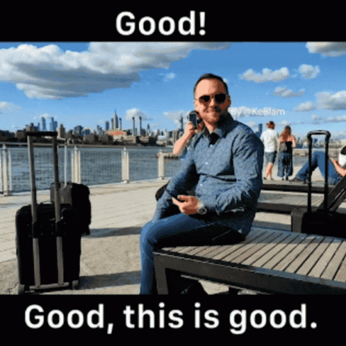 Man Sitting On Bench Talking On Phone GIF