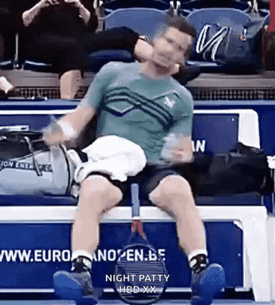 Man Sitting On Bench With Tennis Racquet GIF