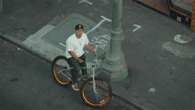 Man Sitting On Bicycle With Number 7 GIF