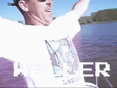 Man Sitting On Boat Arms Outstretched Heller GIF