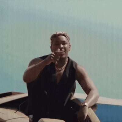 Man Sitting On Boat With Hand On Face GIF