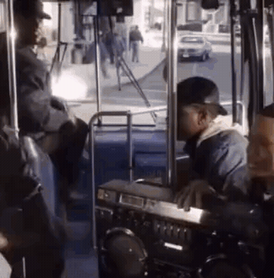 Man Sitting On Bus With Boombox On Dashboard GIF