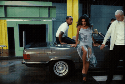 Man Sitting On Car Back Woman Leaning GIF