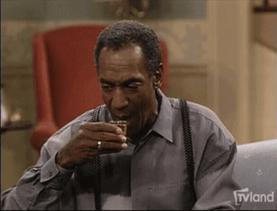 Man Sitting On Couch Drinking Whiskey GIF