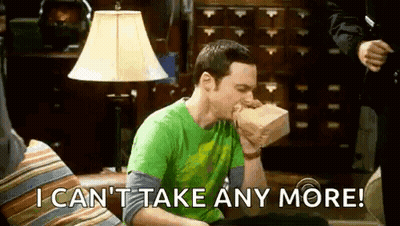 Man Sitting On Couch Eating Sandwich GIF