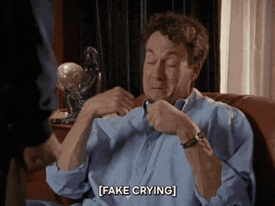 Man Sitting On Couch Fake Crying GIF
