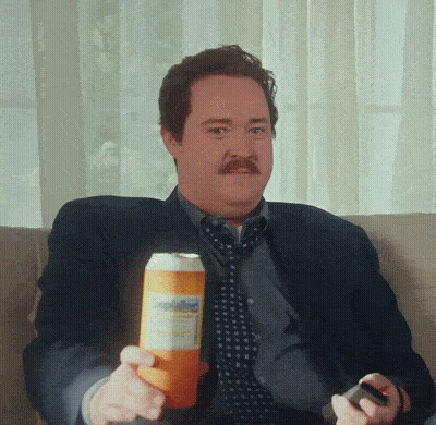 Man Sitting On Couch Holding Soda GIF
