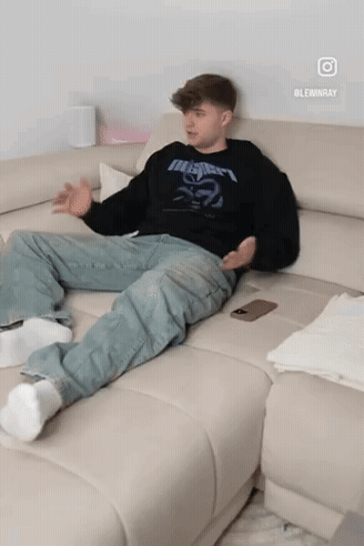 Man Sitting On Couch In Black Metallica Shirt GIF