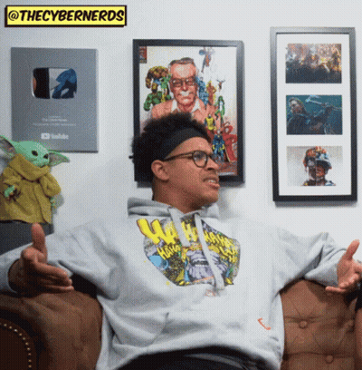 Man Sitting On Couch In Front Of Wall GIF
