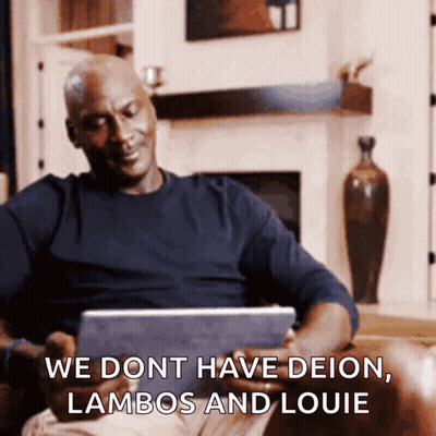 Man Sitting On Couch Looking At Tablet Saying We Dont Have Deion Lambos And Louie GIF