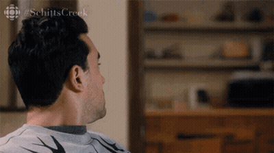 Man Sitting On Couch Looking Away GIF