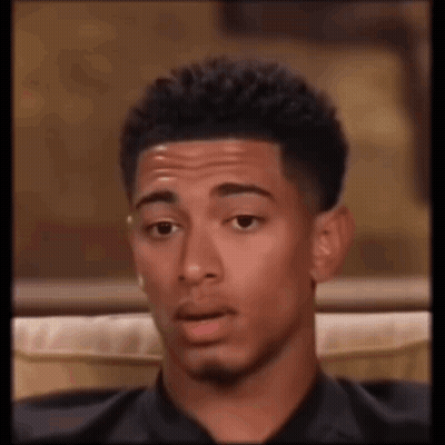 Man Sitting On Couch Making Funny Face GIF