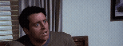 Man Sitting On Couch Making Funny Face GIF