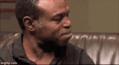 Man Sitting On Couch Mouth Open Looking GIF