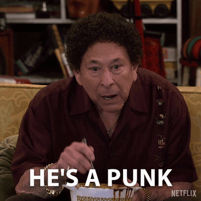 Man Sitting On Couch Netflix Ad Saying Punk GIF