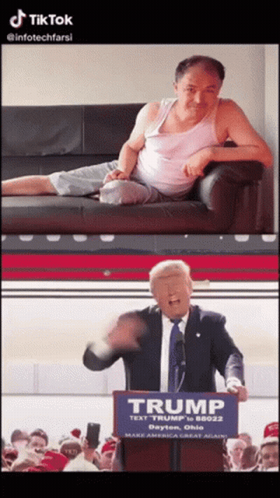 Man Sitting On Couch Next To Man Standing In Front Of Trump Sign GIF