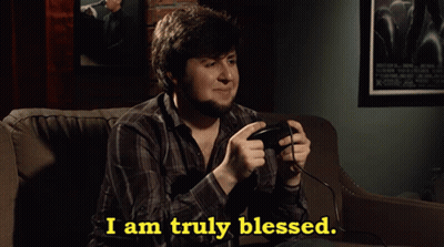 Man Sitting On Couch Playing Video Game Saying I Am Truly Blessed GIF