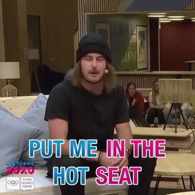 Man Sitting On Couch Put Me In The Hot Seat GIF
