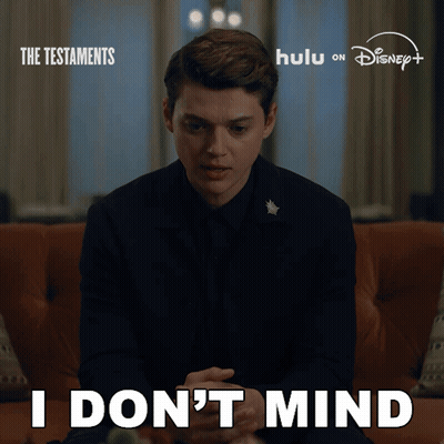 Man Sitting On Couch Saying I Don't Mind GIF