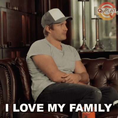 Man Sitting On Couch Saying I Love My Family GIF