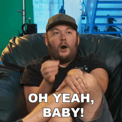Man Sitting On Couch Saying Oh Yeah Baby GIF