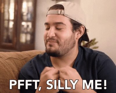 Man Sitting On Couch Saying Pfft Silly Me GIF