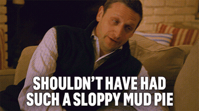 Man Sitting On Couch Saying Shouldn't Have Had Such A Sloppy Mud Pie GIF