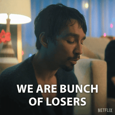 Man Sitting On Couch Saying We Are Losers GIF