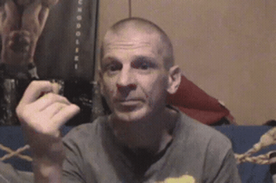 Man Sitting On Couch Smoking Cigar GIF