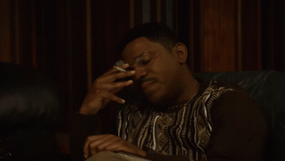 Man Sitting On Couch Smoking Cigarette GIF