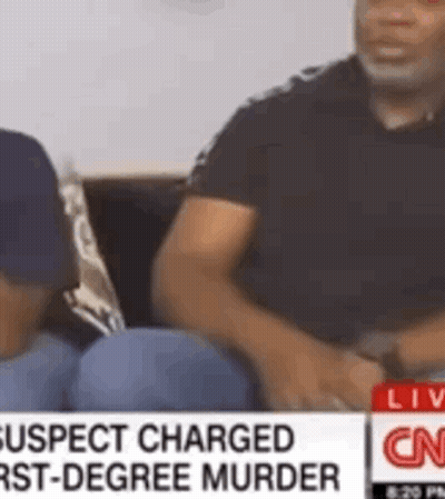 Man Sitting On Couch Talking To Another Man On CNN GIF