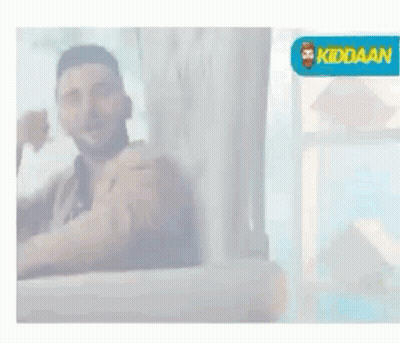 Man Sitting On Couch Thumbs Up Smiling GIF