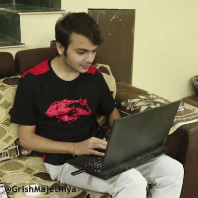 Man Sitting On Couch Using Laptop @Grishmajethiya GIF