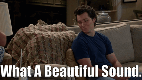 Man Sitting On Couch What A Beautiful Sound GIF