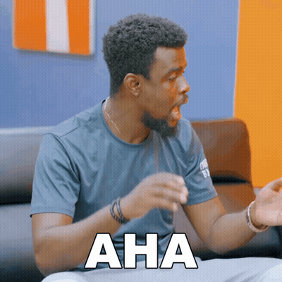 Man Sitting On Couch With Aha On Chest GIF
