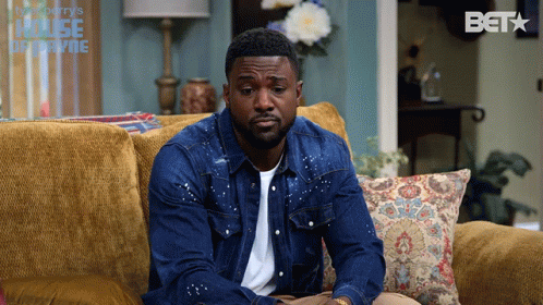 Man Sitting On Couch With Bet Logo GIF