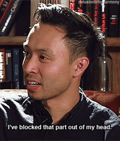 Man Sitting On Couch With Blocked Out Head GIF