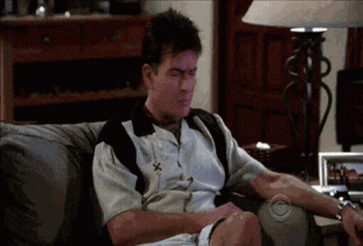 Man Sitting On Couch With CBS Logo GIF