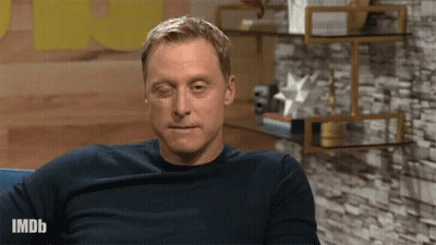 Man Sitting On Couch With IMDb Shirt GIF