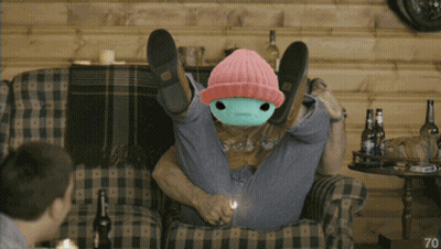 Man Sitting On Couch With Stuffed Animal On Head Number 70 GIF