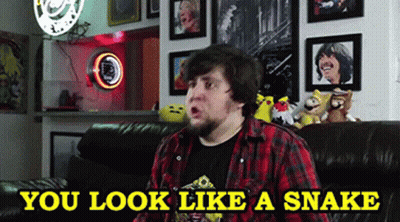 Man Sitting On Couch You Look Like A Snake GIF