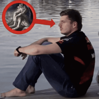 Man Sitting On Dock With Red Arrow Pointing To Wolf Painting GIF